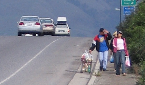 Family is using the same shoulder on the bridge, and using the dirt path. Prior to constructing the sidewalk, circa 2000, walkers also used the shoulder on the other side.