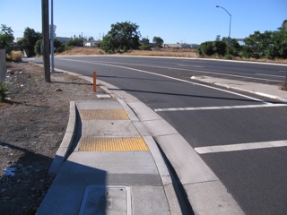 Central at DeLaCruz (SW corner). Path continues, but is bad shape.