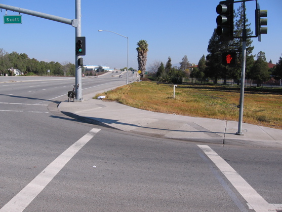 This San Tomas intersections (at Scott) has a smaller radius corner, the current practice that is safer.