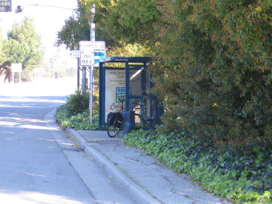 Sidewalk or dirt path needs to continue beyond this bus stop. 